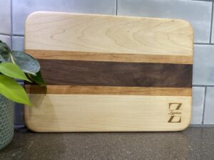 Handcrafted wooden cutting board with custom engraving – premium hardwood kitchen board, perfect for serving, chopping, and gifting. Custom orders available.